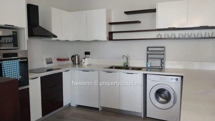 Elegant beachfront 3-bedroom apartment with private garden & direct beach access. 