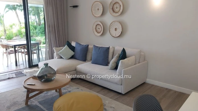 Elegant beachfront 3-bedroom apartment with private garden & direct beach access. 