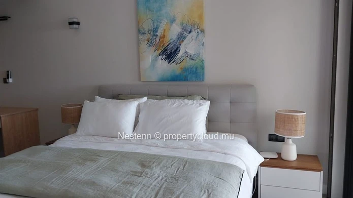 Elegant beachfront 3-bedroom apartment with private garden & direct beach access. 