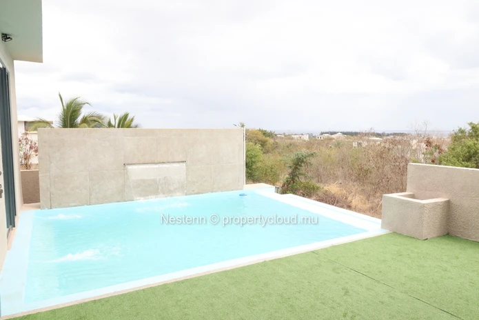 Modern house with swimming pool upstairs and sea and mountain views.