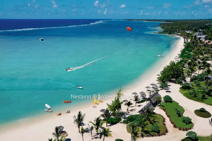 Elegant beachfront 3-bedroom apartment with private garden & direct beach access. 