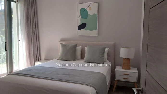 Elegant beachfront 3-bedroom apartment with private garden & direct beach access. 