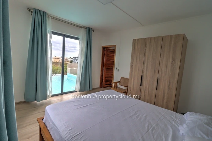 Modern house with swimming pool upstairs and sea and mountain views.