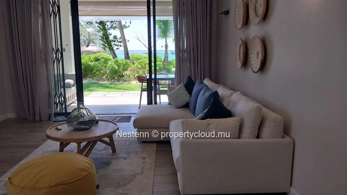 Elegant beachfront 3-bedroom apartment with private garden & direct beach access. 