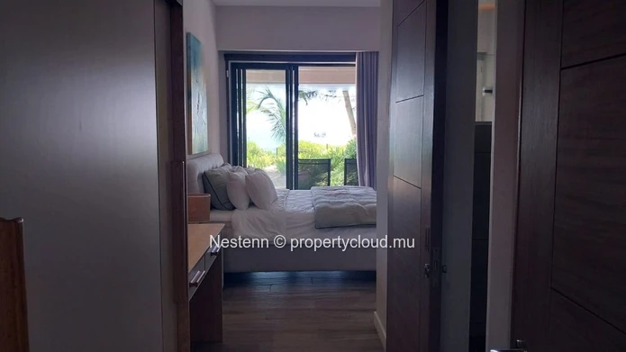 Elegant beachfront 3-bedroom apartment with private garden & direct beach access. 